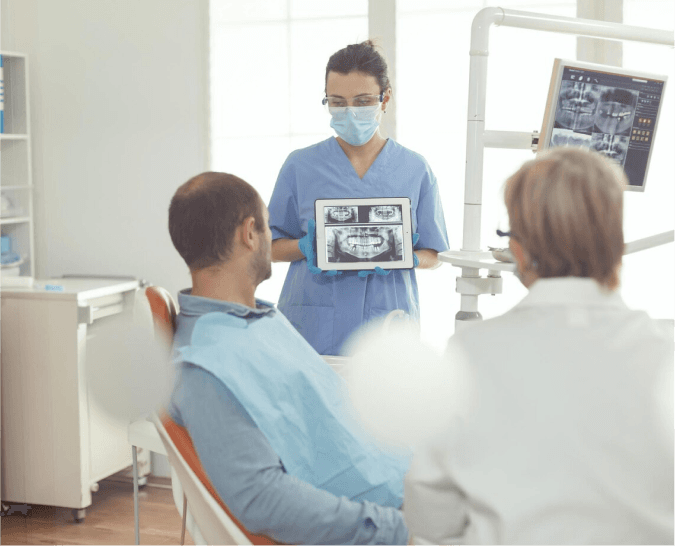 Healthcare professional using a laptop with holographic medical icons